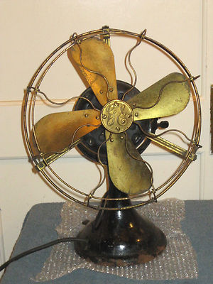 Antique 4 brass blades and cage electric fan.