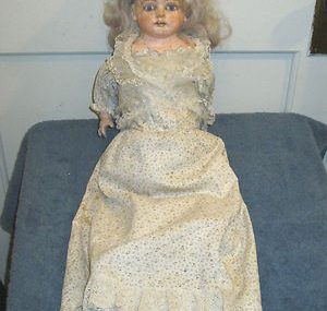 Antique wax and composition doll.